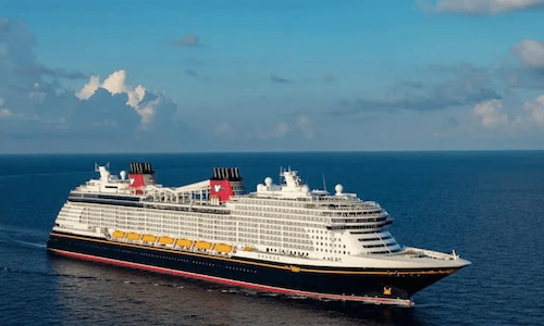 A Disney cruise ship in open water.